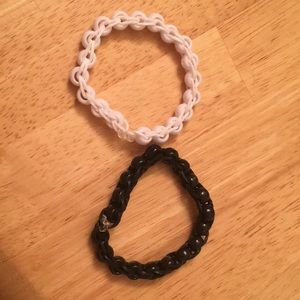 A black bracelet and a white bracelet